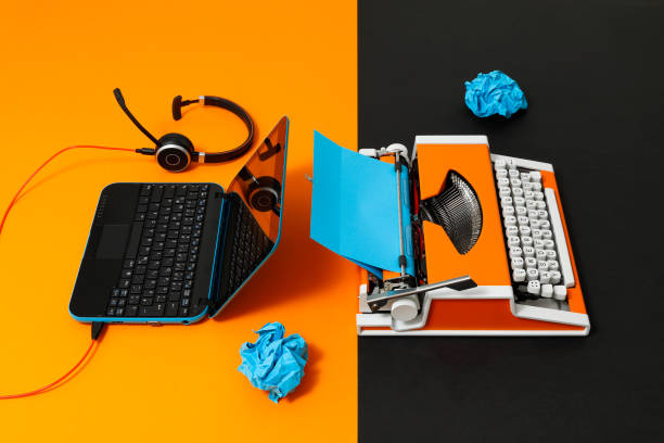 istock Digital and analog – Laptop and 70s Typewriter 1363834896
