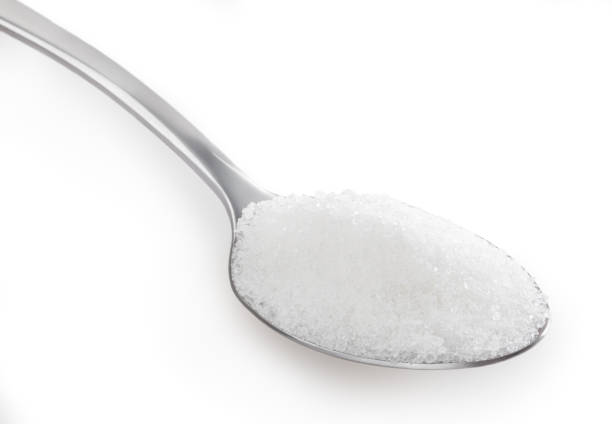 istock Teaspoon of white sugar isolated on white background with clipping path 1363836105