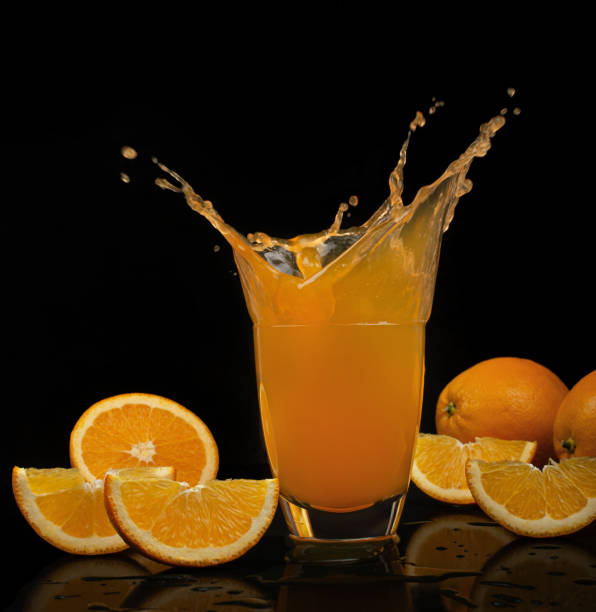 istock Splashing orange juice isolated on white 1363837022