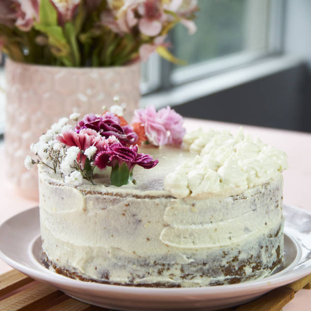 istock Vanilla cake with flowers Pink 1363838501