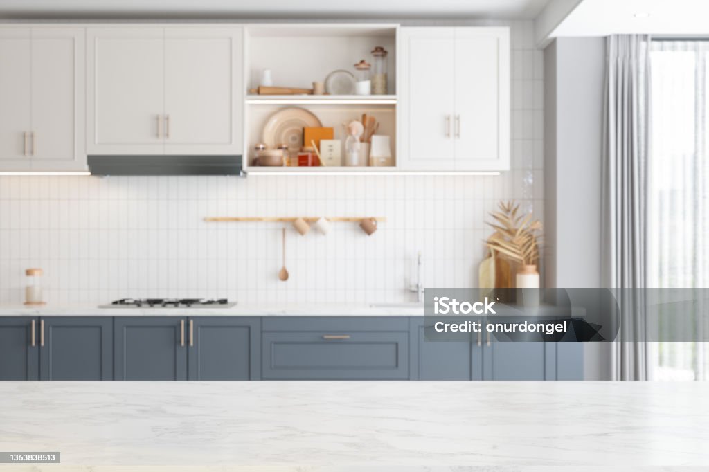Empty Marble Kitchen Countertop With Defocused Kitchen Background. Kitchen Stock Photo