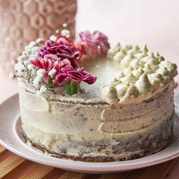 istock Vanilla cake with flowers Pink 1363838516