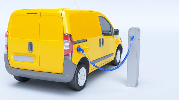 istock Electric minivan at charging station yellow 1363838589