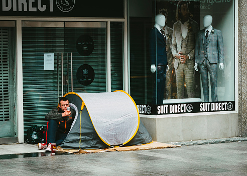 homeless man in the city with the tent in Dublin, Ireland