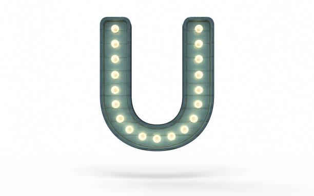 istock Letter U decorated with light bulb covered with green wood 1363840080