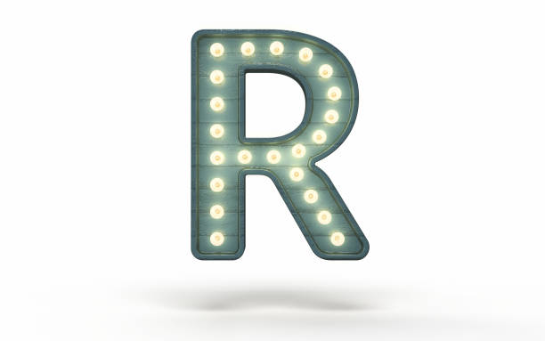 istock Letter R decorated with light bulb covered with green wood 1363840179