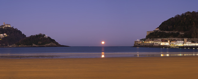 Moonset on La Concha beach, city of Donostia-San Sebastian, Euskadi