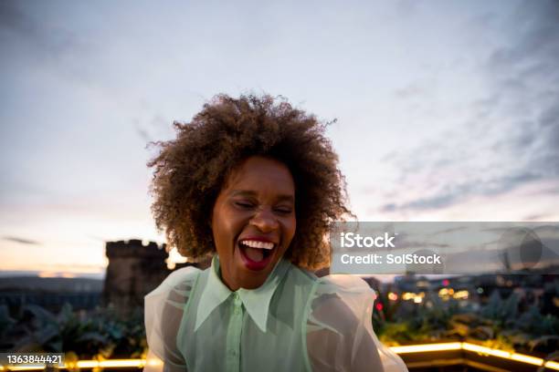Dancing On The Rooftops Stock Photo - Download Image Now - One Woman Only, Excitement, Bar - Drink Establishment