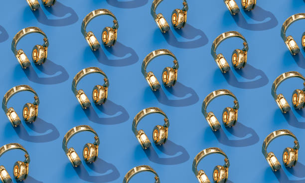 gold wireless hi-fi headphones on blue