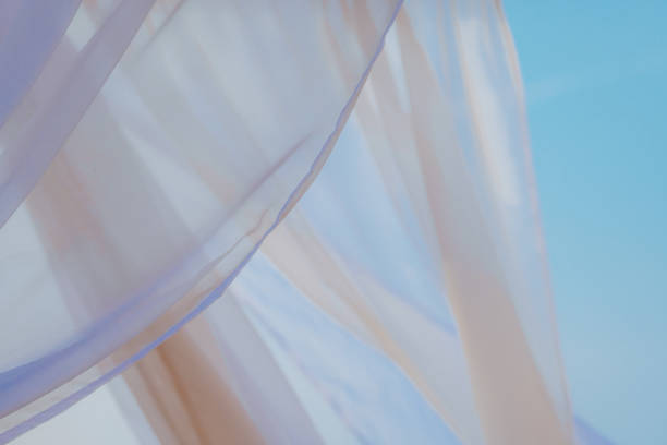 White pergola curtains at seaside stock photo