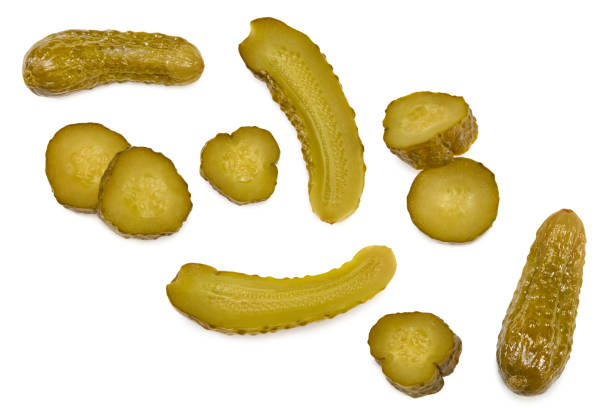 istock marinated pickled cucumbers with slices isolated on white background. Clipping path and full depth of field. Top view 1363848173