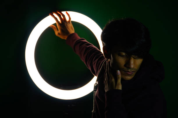 istock man posing look in front of the ring light 1363848388