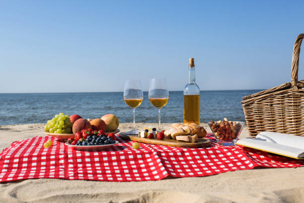 istock Food and wine on beach. Summer picnic 1363852425