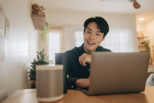 istock Businessman talk to voice assistant to control at home 1363853073