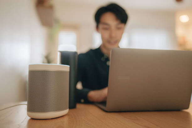 istock Businessman talk to voice assistant to control at home 1363853092