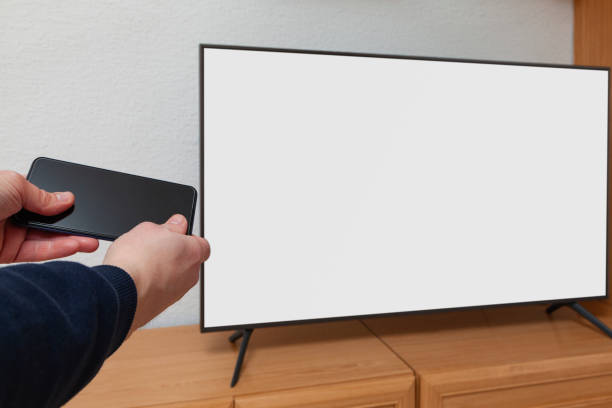 istock Sending information from a cell phone to a TV 1363854455