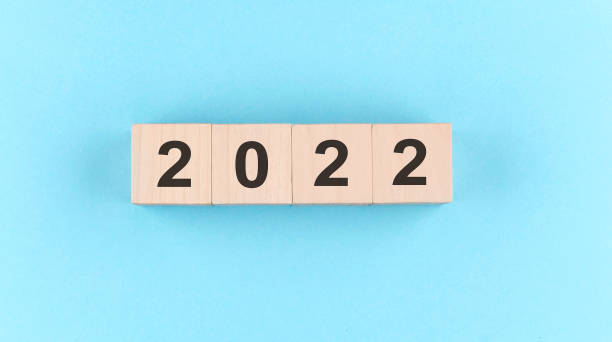 istock Wooden cube block with text 2022 on the blue background 1363854808