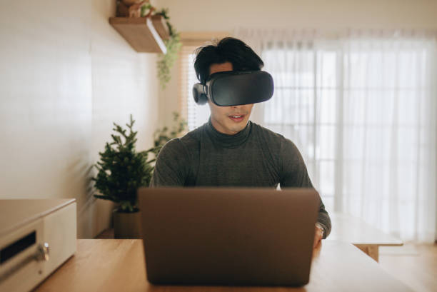 istock The Metaverse : Young man meeting with Virtual Reality at Home. 1363855111