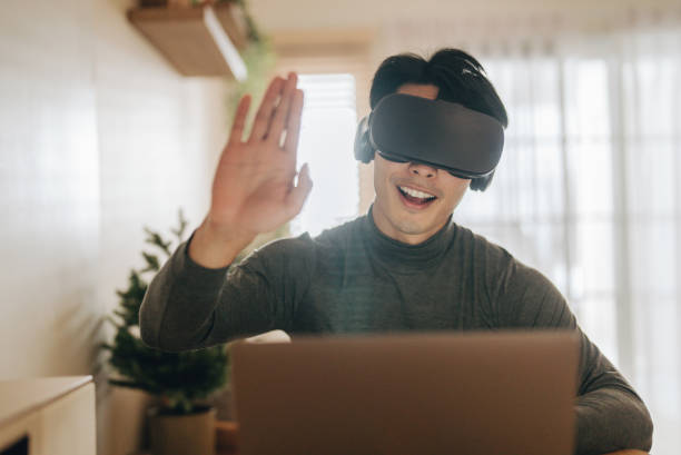 istock The Metaverse : Young man meeting with Virtual Reality at Home. 1363855153