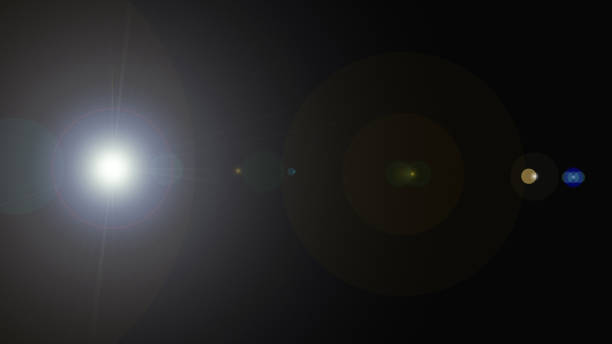 istock Abstract Gradient Flare Background: digital lens flare on black background 1363855814