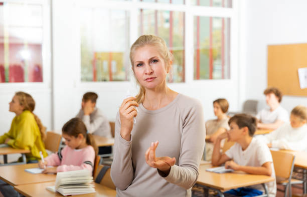 istock Portrait of teacher in classroom 1363856548