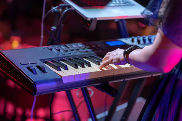 istock Keyboardist play keyboard on stage. 1363857333