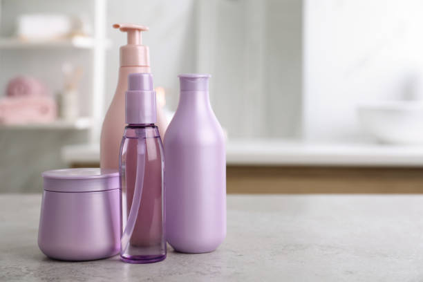 istock Different hair care products on table in bathroom, space for text 1363857400