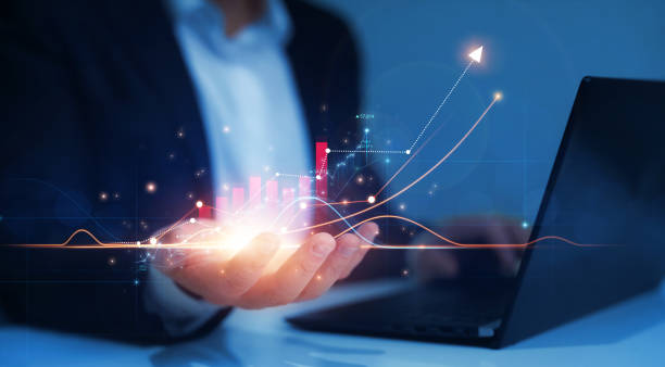 istock Business development, financial plan and  strategy. Business industry development.Businessman hand holding arrow up with graph of business analysis. 1363857441