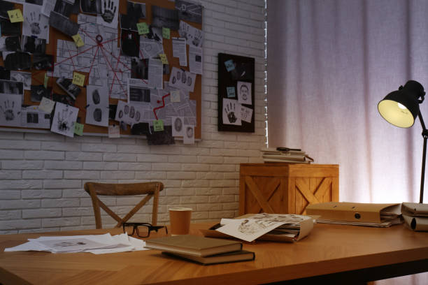 istock Detective office interior with workplace and investigation board 1363857526