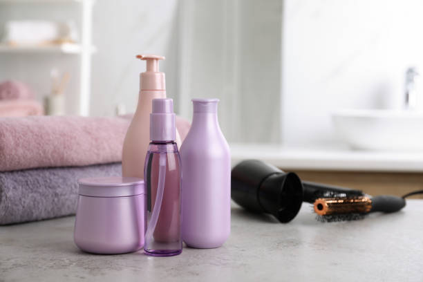 istock Different hair care products on table in bathroom, space for text 1363857611