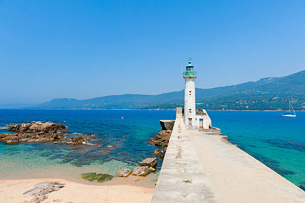 istock White lighthouse overlooking ocean at Propriano, Corsica 136385790