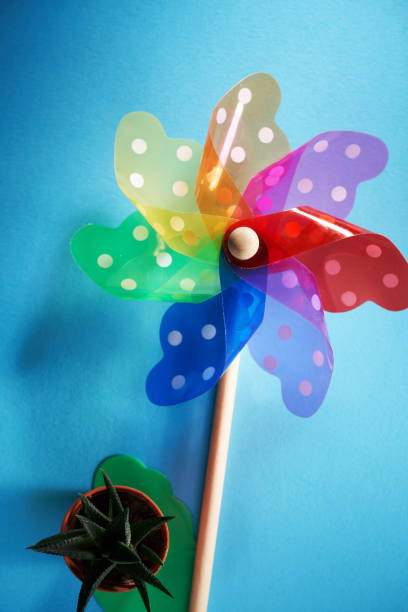 istock colorful pinwheel and potted dot on blue background 1363859113