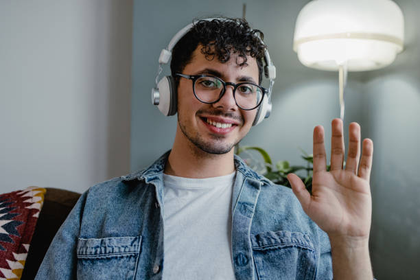 istock Young talking on a video call and looking at the camera 1363859866