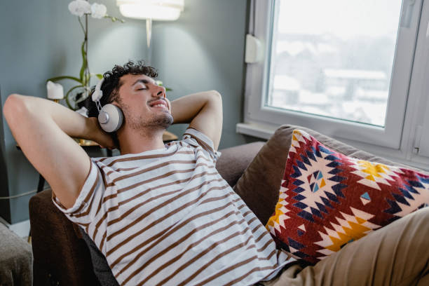 istock Young man relaxing at home 1363859941