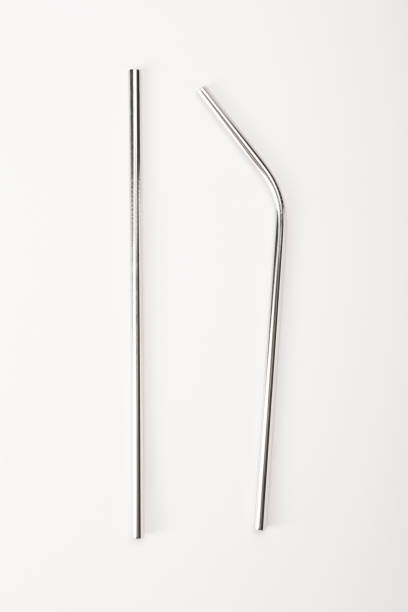 istock Stainless steel reusable drinking straw set, metallic pipette on the white background 1363862572