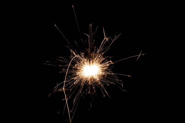 istock Burning sparkler isolated on black background. Fireworks theme. Light effect and texture. 1363867363