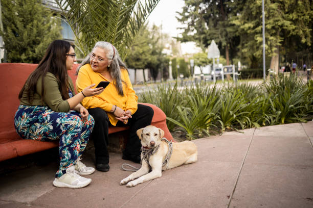 istock Mother and daughter using mobile phone 1363868300