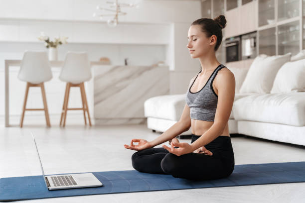 istock Girl practicing meditation at home 1363868693