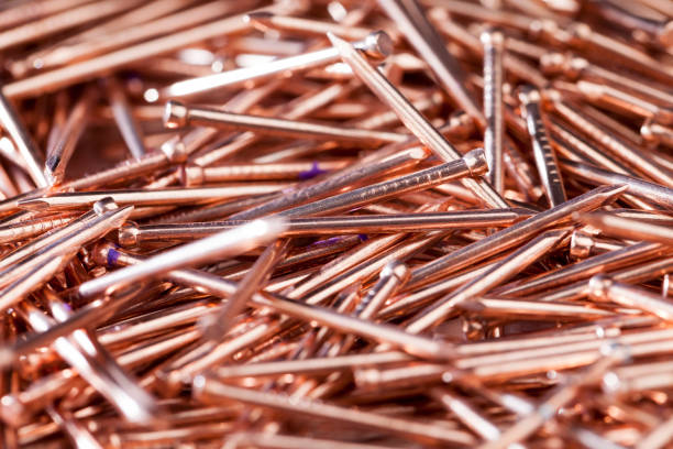 istock nails are covered with a thin layer of copper-colored metal 1363869545