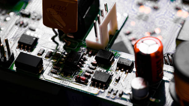 istock Close up of components and microchips on PC circuit board 1363870257