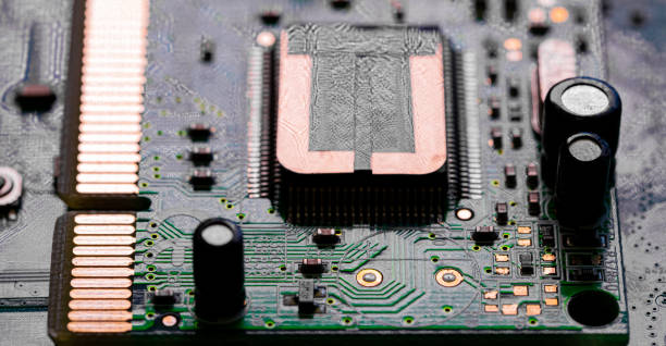 istock Close up of components and microchips on PC circuit board 1363870974