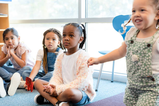 istock Kindergarten students listen to unseen teacher 1363871094