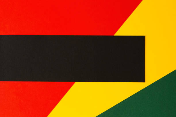 istock Abstract geometric background. Black horizontal stripe with copy space on red, yellow, green color background. Black History Month background 1363871161