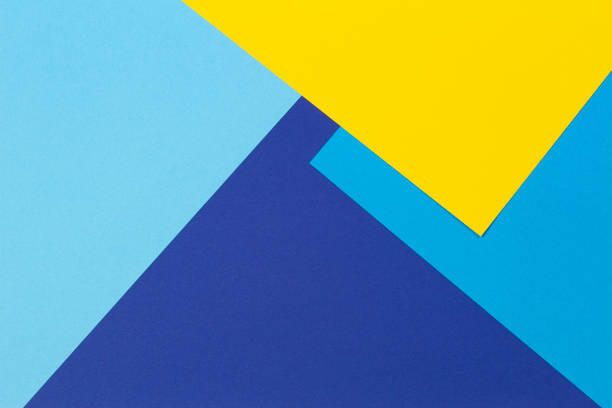 istock Creative abstract blue and yellow color geometric paper composition background, top view 1363871191