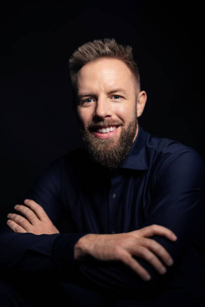 istock Handsome young man portrait on black background 1363871210
