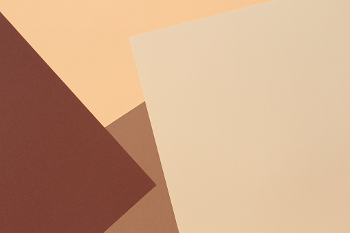 Papel de color geometría composición fondo de banner con tonos beige, marrón claro y marrón oscuro. photo