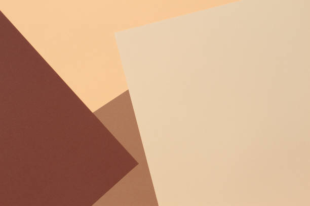 Color papers geometry composition banner background with beige, light brown and dark brown tones. stock photo