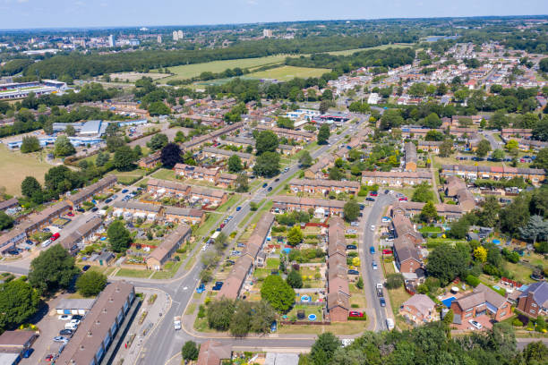 Aerial photo of the British town of Stevenage in Hertfordshire UK showing a typical British housing estate with rows of houses in the village, on a hot sunny summers day. stock photo