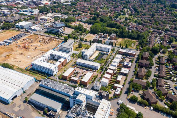 Aerial photo of the British town of Stevenage in Hertfordshire UK showing a a housing estate being built on a construction site on a hot sunny summers day stock photo