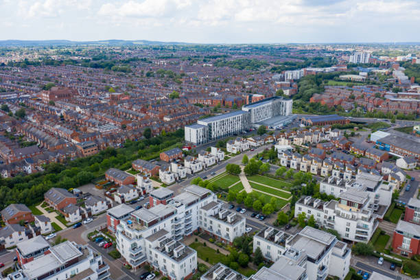 Aerial photo of the city centre of Leicester in the UK showing houses and apartment building on a sunny summers day with white clouds in the sky stock photo